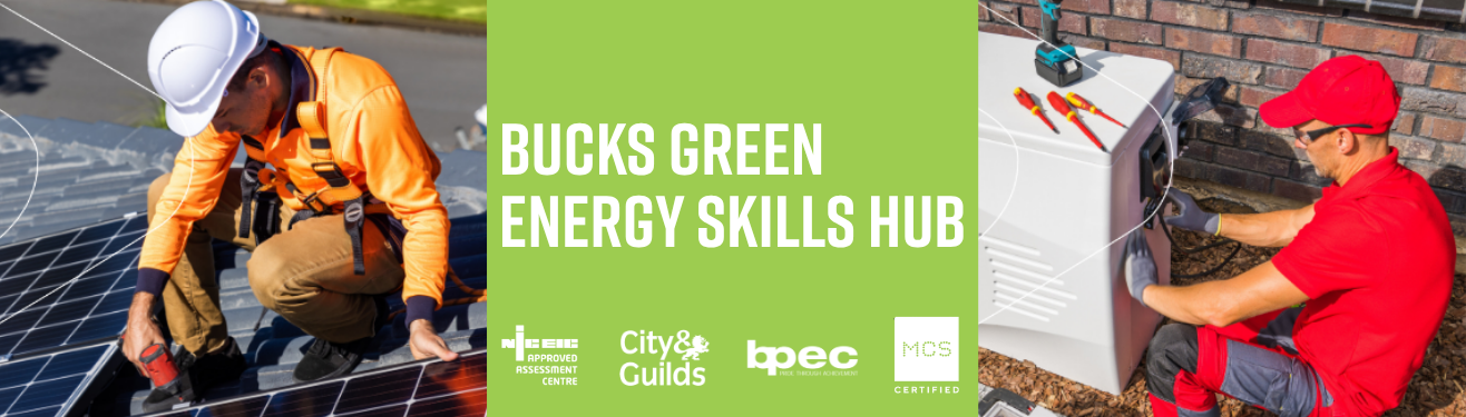 Students wearing hard hats and hi-vis jackets next to Air Source Heat Pump