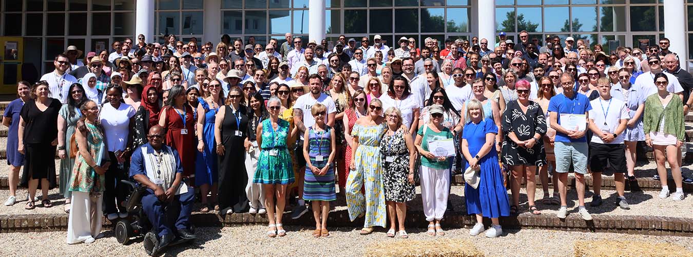 Buckinghamshire College Group staff standing together outside smiling 