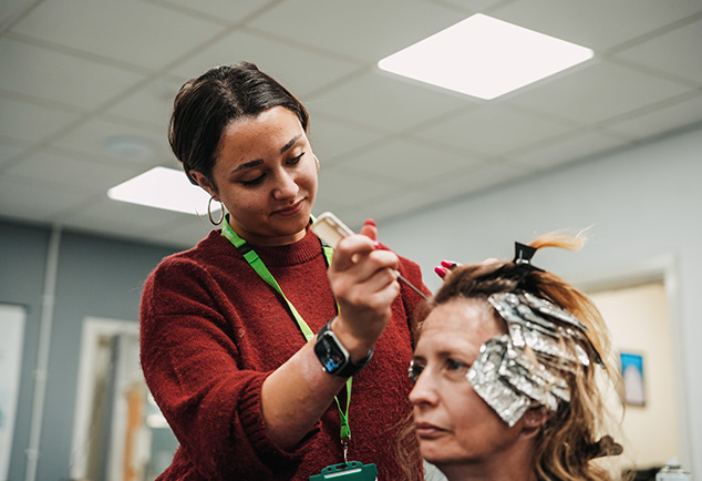 Student dying a woman's hair