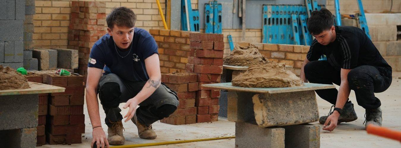 Students working in brick workshop