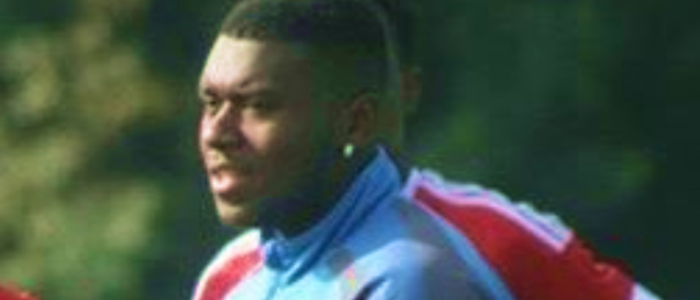 Photo of former student in his current role as a Football Coach