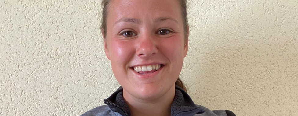 Photo of former student in her current role as Rugby Cluster Officer