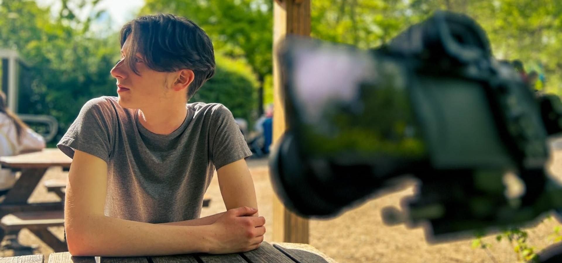 man in front of camera