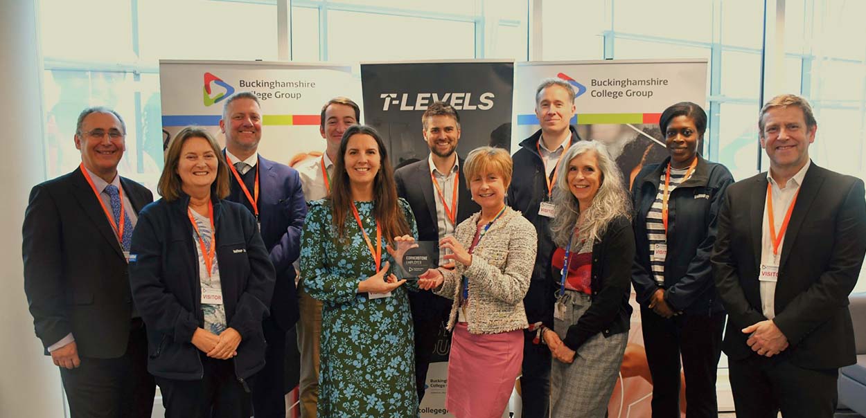 Buckinghamshire College staff presenting glass plaque to members of Buckinghamshire Highways